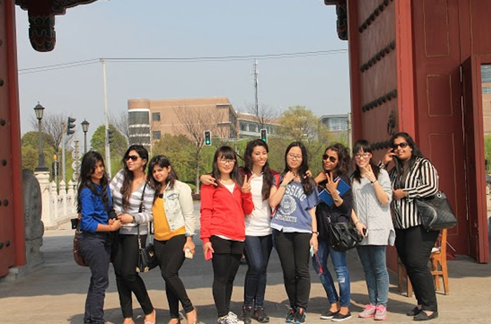 9. Girls with SJTU student volunteers